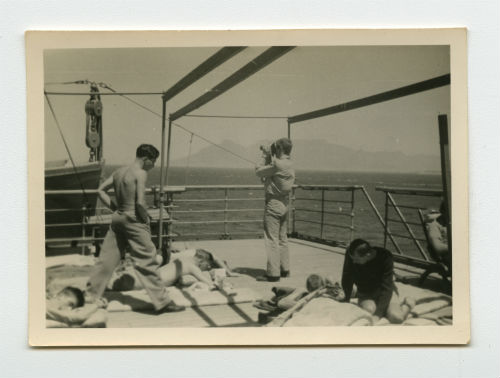 Men sunbathing on the SS El Nil. Recto