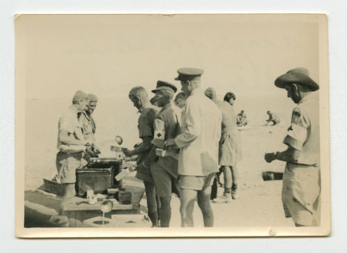 A couple of New Zealanders dish up a meal near Marsa Matruh, Egypt. Recto