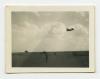 Aircraft flying over parked ambulances