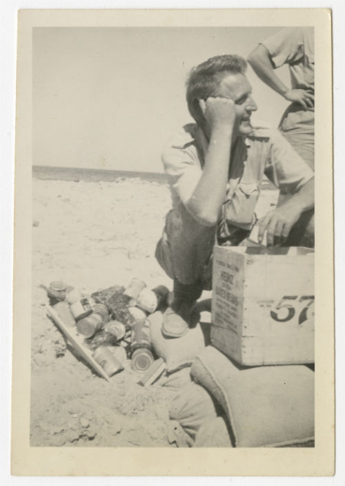 Dave Hyatt with a box of canned food. Recto