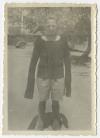 Hugh White wearing a sweater donated by the Detroit Ladies Club. Recto