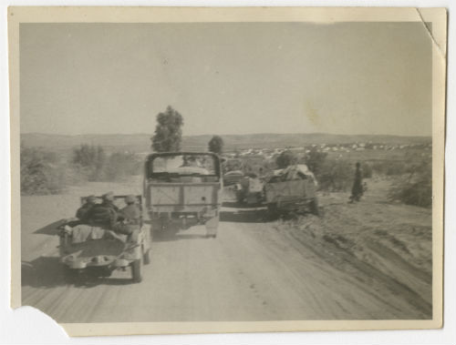 Traffic on a road in Tripolitania. Recto