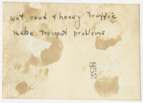 Wet road and heavy traffic make transport problems. Verso