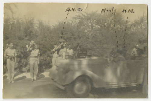 Arthur Howe, Jr. saluting King George VI and General Montgomery during the review in Tripoli