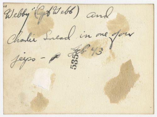 "Webby" and Charles "Charlie" Snead in an AFS jeep. Verso