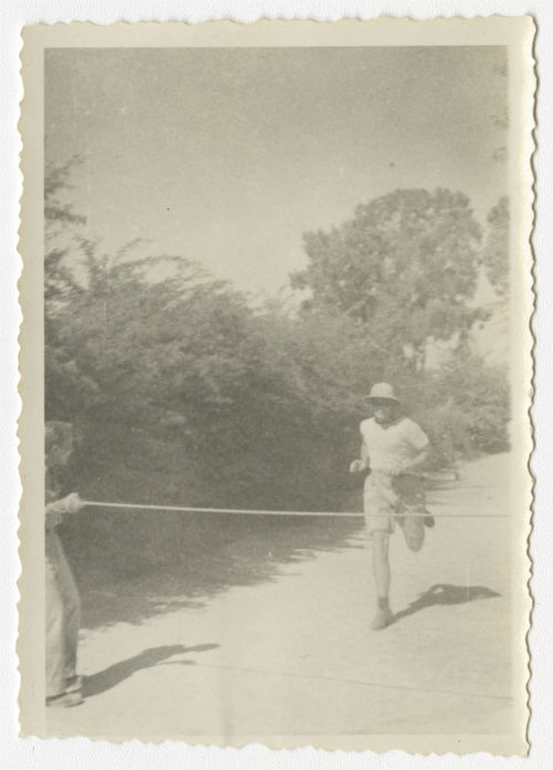 Bayard "Newport Nellie" King crossing the finish line during a foot race near Al-Swani, Libya