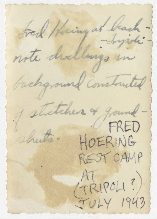 Frederick "Fred" Hoeing at a beach in Tripoli, Libya. Verso