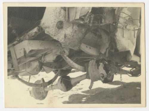 Land mine damage on the undercarriage of an AFS ambulance. Recto