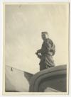 "Webby" standing on a vehicle. Recto