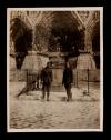 A. Piatt Andrew (right) with an ambulance driver standing in front of the Reims Cathedral...