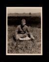 A. Piatt Andrew sitting in the grass