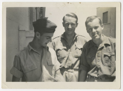 Evan Thomas (on the left) and two unidentified individuals. Recto